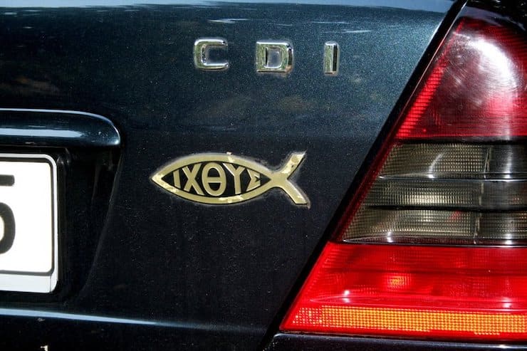 Why stick a fish symbol on the trunk of a car?